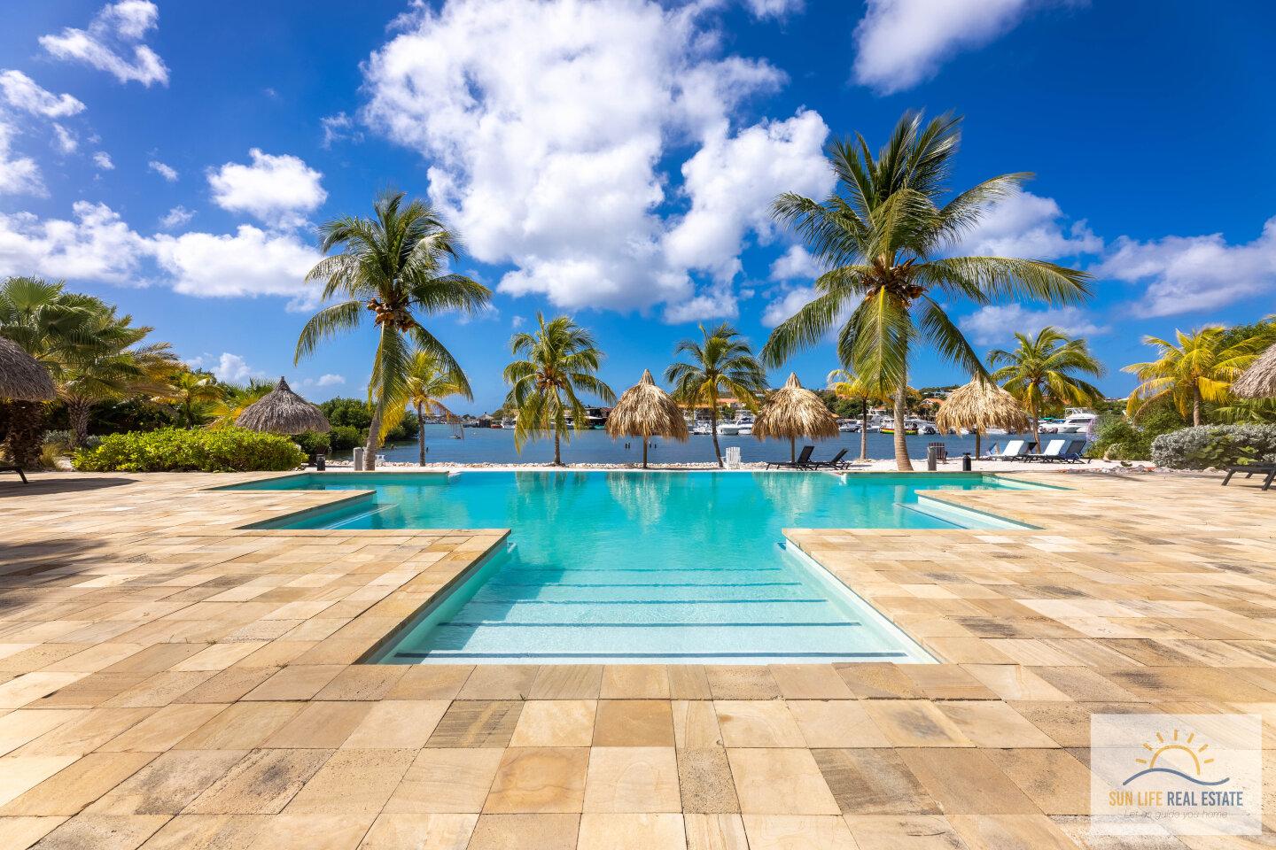 Waterfront Apartment with Private Beach  for Sale on Spanish Water Resort