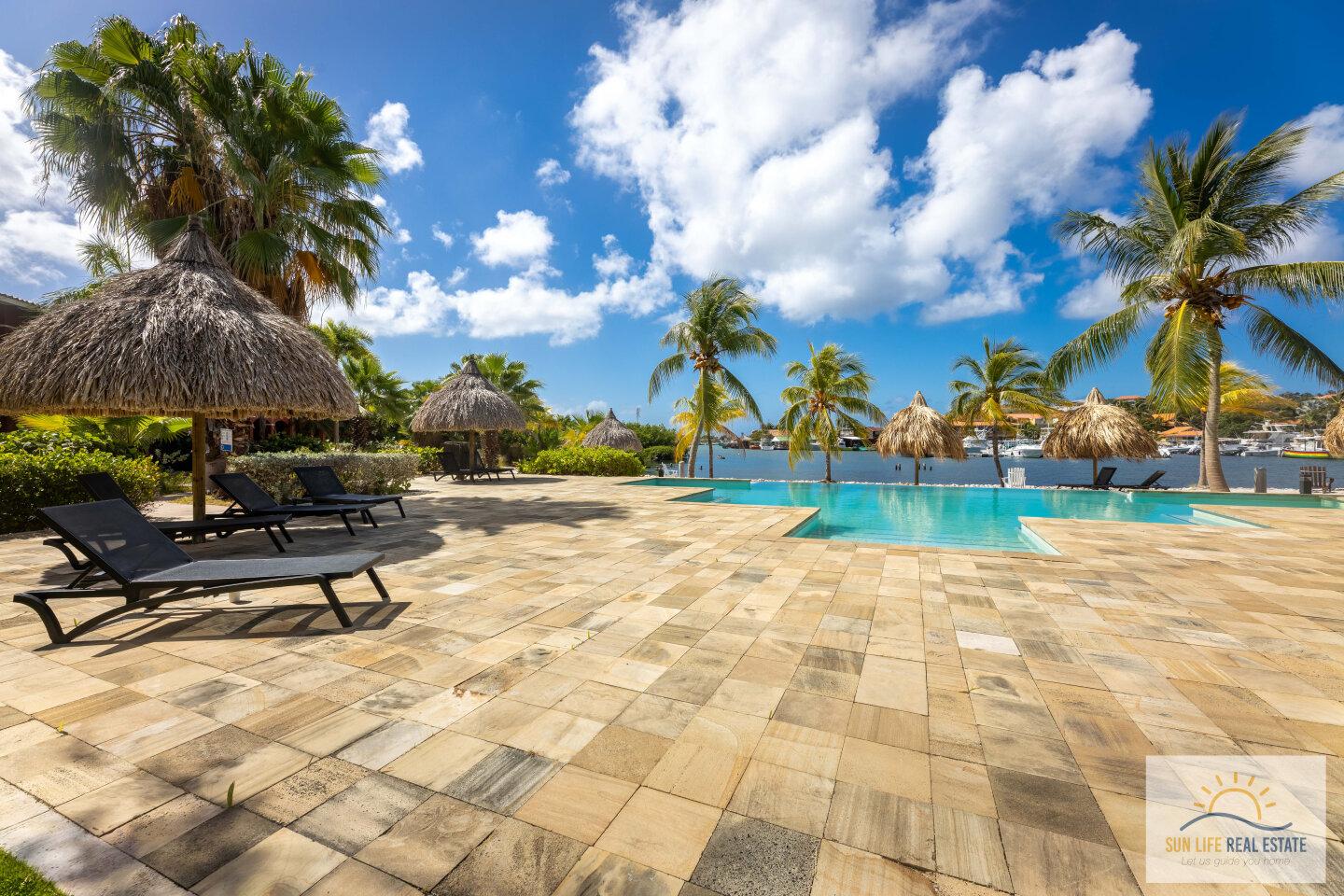 Waterfront Apartment with Private Beach  for Sale on Spanish Water Resort