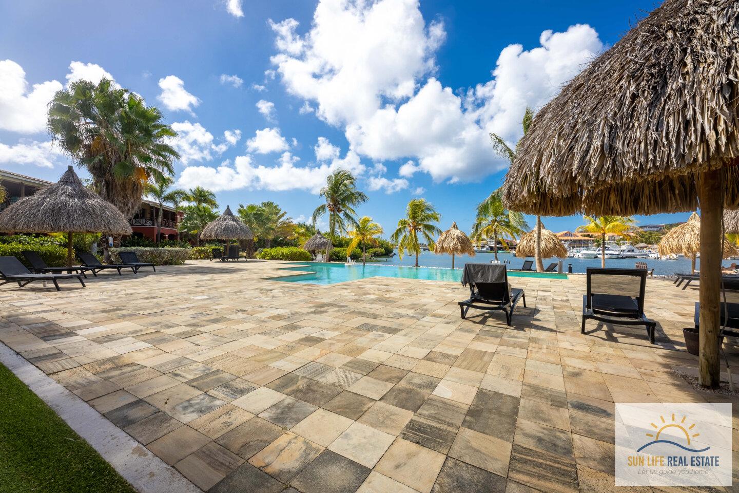 Waterfront Apartment with Private Beach  for Sale on Spanish Water Resort